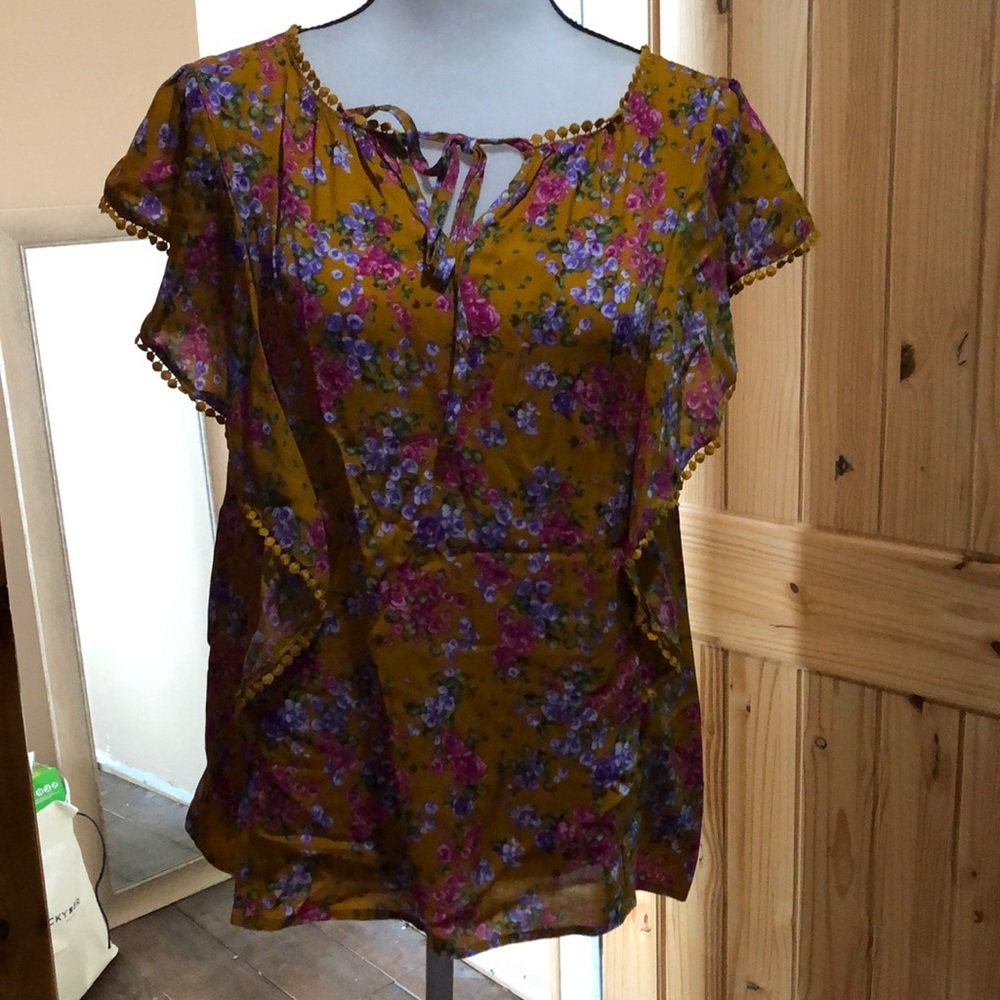 Blouse with embellishments